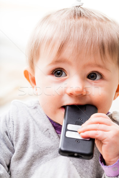 Criança degustação controle remoto verificar bom menina Foto stock © Giulio_Fornasar