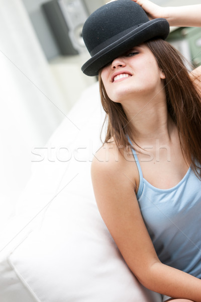 Playful young woman wearing a bowler hat Stock photo © Giulio_Fornasar