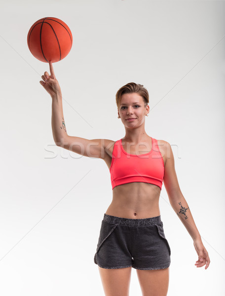 Vrouw balancing basketbal vinger jonge vrouw lichaam Stockfoto © Giulio_Fornasar