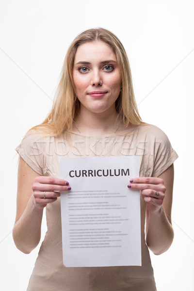 Stock photo: Young woman holding her resume