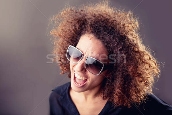 curly haired inspired young woman singing Stock photo © Giulio_Fornasar