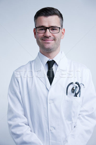 self confident available doctor in white coat Stock photo © Giulio_Fornasar