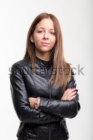 Confident young woman in a leather jacket Stock photo © Giulio_Fornasar