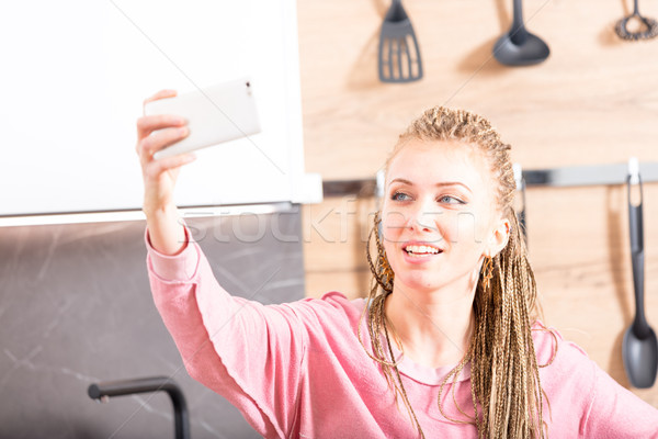 High key portrait of a woman taking a selfie Stock photo © Giulio_Fornasar