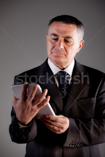 old man using a digital tablet Stock photo © Giulio_Fornasar