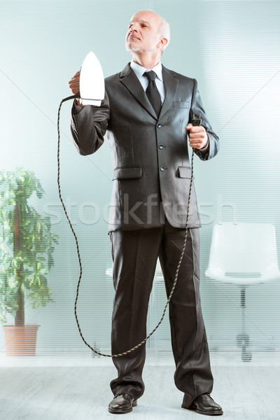 businessman holding a flatiron and posing Stock photo © Giulio_Fornasar