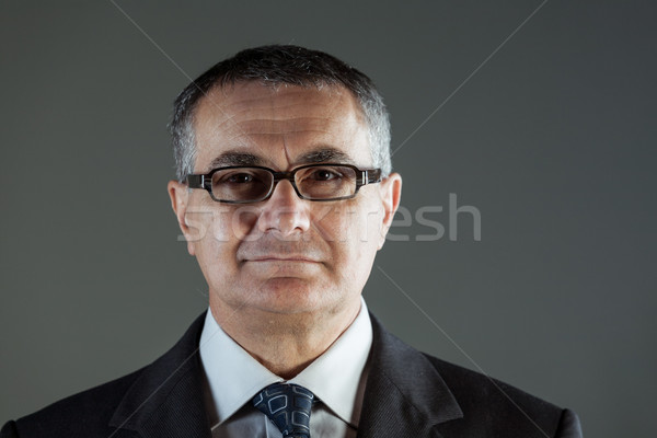 Attractive middle-aged businessman in glasses Stock photo © Giulio_Fornasar