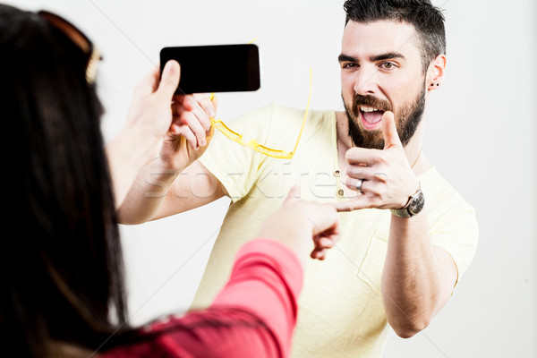 thrilled couple taking mobile photographs and selfies Stock photo © Giulio_Fornasar