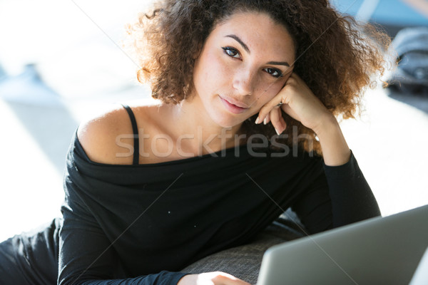 Pensive attractive young woman looking at camera Stock photo © Giulio_Fornasar