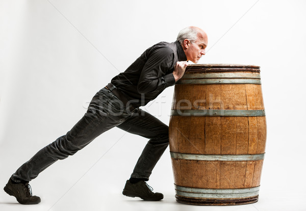 man pushing a barrel very resolute Stock photo © Giulio_Fornasar