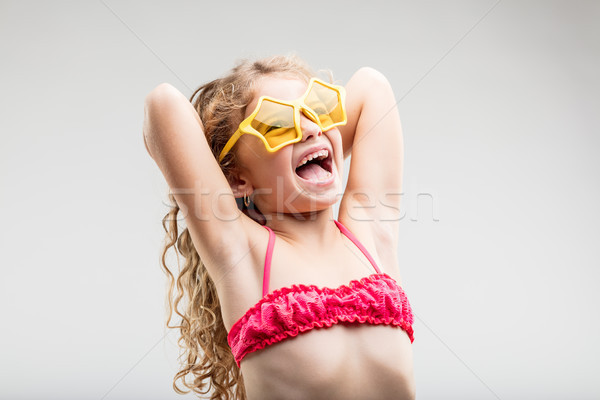 Vivacious fun little girl wearing trendy glasses Stock photo © Giulio_Fornasar