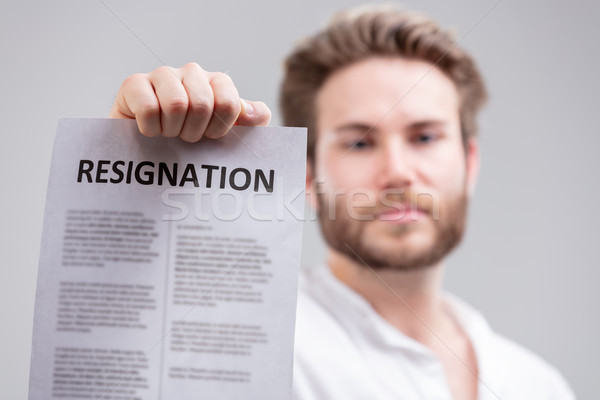 Man holding up a resignation letter Stock photo © Giulio_Fornasar