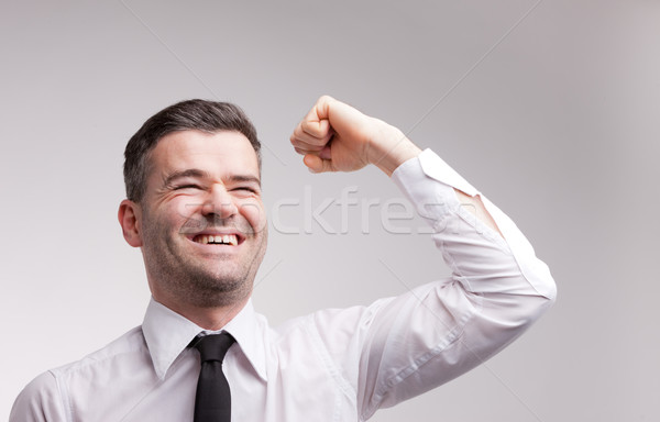 happy man exulting raising his arm Stock photo © Giulio_Fornasar