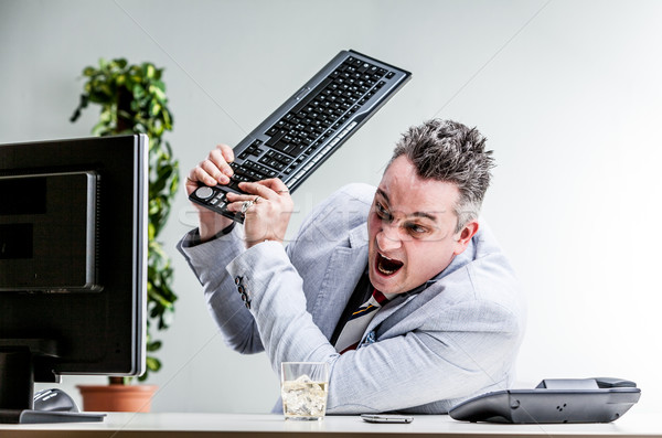 office worker destroying his computer Stock photo © Giulio_Fornasar