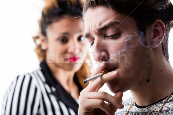 Man roken vrouw teleurstelling rook sigaret Stockfoto © Giulio_Fornasar