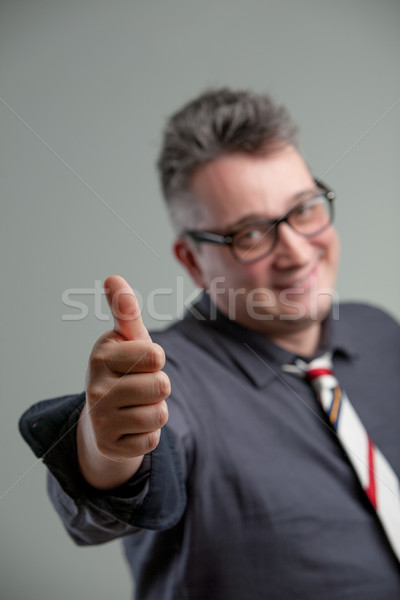 focus on thumb up with old man in background Stock photo © Giulio_Fornasar