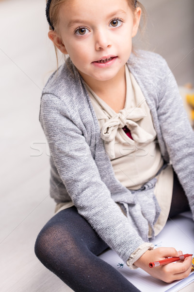 Natural portrait of a little girl drawing on a bed Stock photo © Giulio_Fornasar