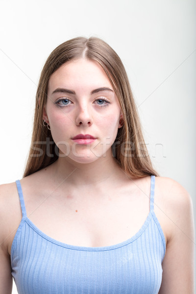 Young woman with a serious deadpan expression Stock photo © Giulio_Fornasar