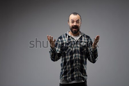Angry man screaming and throwing a temper tantrum Stock photo © Giulio_Fornasar