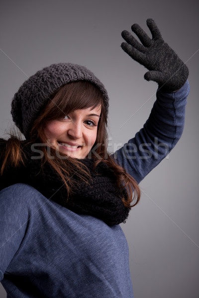 girl waving at camera with warm hat scarf and gloves Stock photo © Giulio_Fornasar
