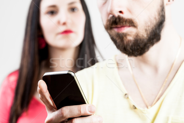 woman disappointed about his man on his mobile Stock photo © Giulio_Fornasar