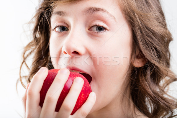 girl eats red apple on white background Stock photo © Giulio_Fornasar