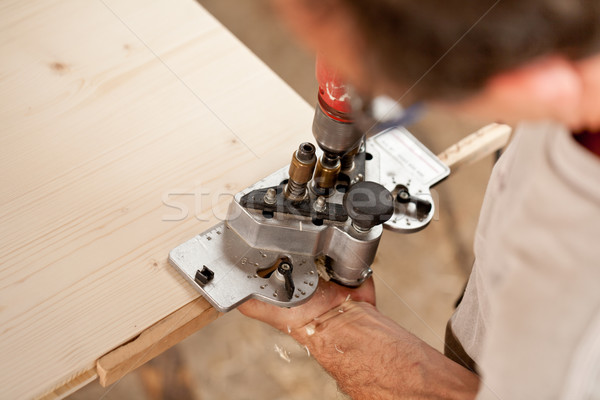 carpenter placing a jig and piercing Stock photo © Giulio_Fornasar