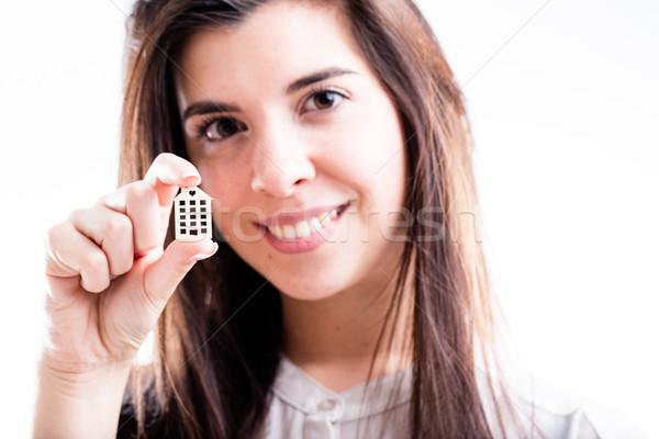 woman holding a little house in her hand smiling Stock photo © Giulio_Fornasar