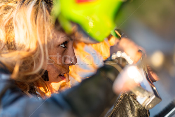 woman setting up her motorcycle to run Stock photo © Giulio_Fornasar
