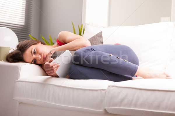 Kadın endişeli kötü haber kanepe bakıyor bir şey Stok fotoğraf © Giulio_Fornasar