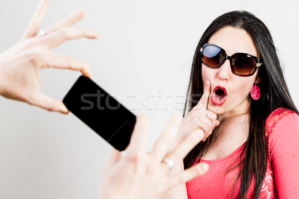 thrilled couple taking mobile photographs and selfies Stock photo © Giulio_Fornasar