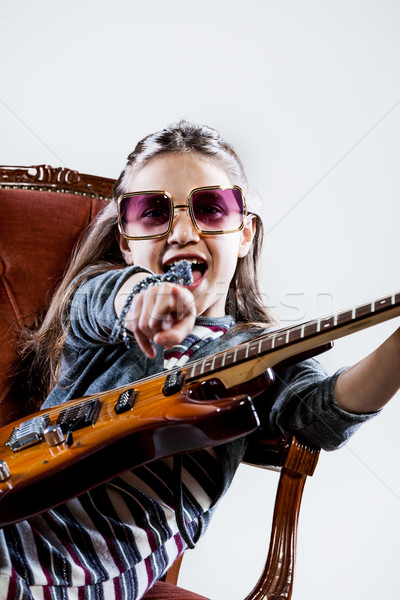 Kislány játszik gitár hős rocksztár kő Stock fotó © Giulio_Fornasar