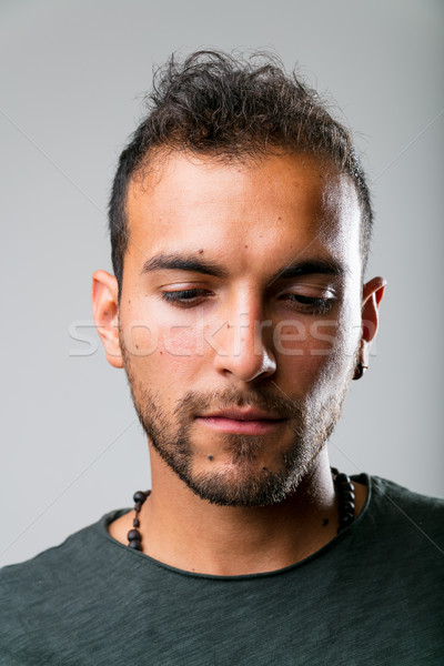 Młodych zmartwiony człowiek studio portret Zdjęcia stock © Giulio_Fornasar