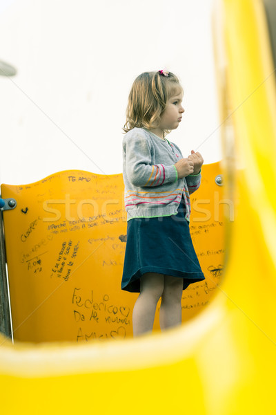 little girl on a slide watching something Stock photo © Giulio_Fornasar