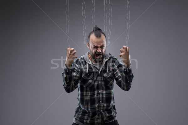 Angry frustrated man screaming and clenching fists Stock photo © Giulio_Fornasar