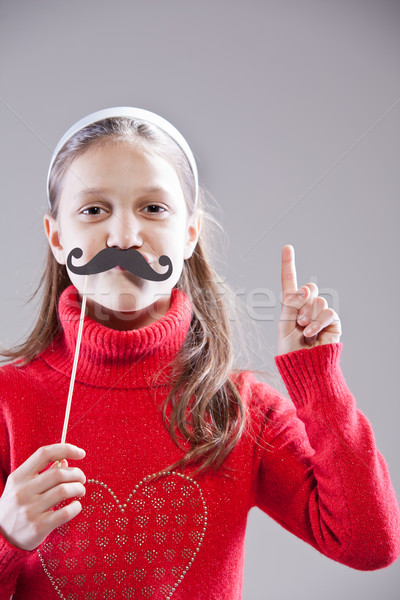 Little girl with fake mustache laying down the law Stock photo © Giulio_Fornasar