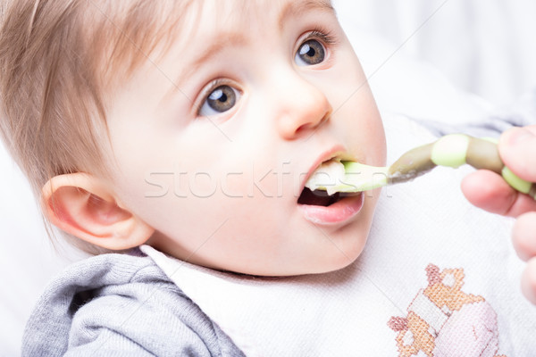 infant girl fed by her mother's hand Stock photo © Giulio_Fornasar