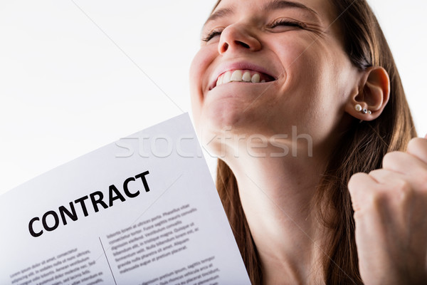 smiling woman holding a contract Stock photo © Giulio_Fornasar