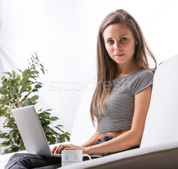 woman working at home on a notebook Stock photo © Giulio_Fornasar