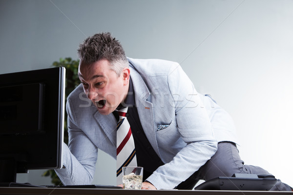 Stock photo: boss read bad news and explodes