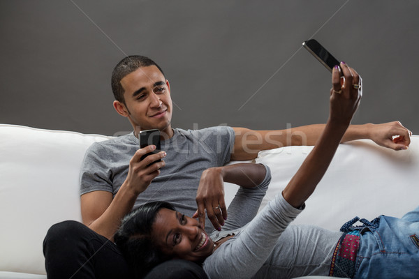young man and a woman using mobile phones Stock photo © Giulio_Fornasar