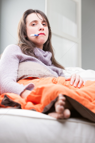 Mujer sofá gripe termómetro boca Foto stock © Giulio_Fornasar