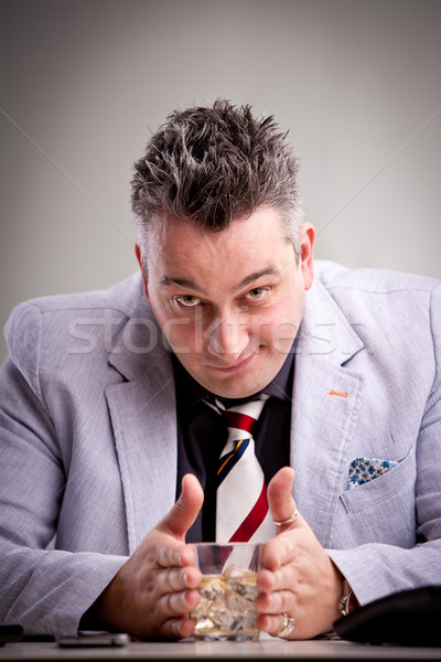clever businessman with his drink Stock photo © Giulio_Fornasar