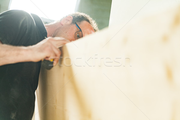 woodworker artisan in his workshop measuring Stock photo © Giulio_Fornasar