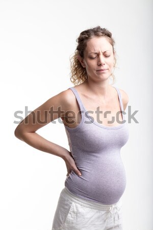 Kobieta ból w krzyżu ciąży biały cierpienie baby Zdjęcia stock © Giulio_Fornasar