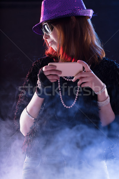 woman dressed as a popstar with a mobile Stock photo © Giulio_Fornasar