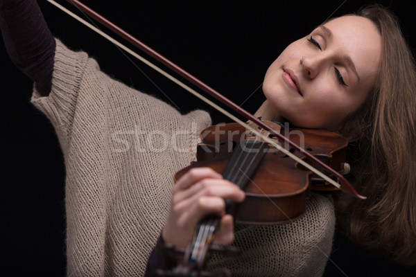 passionate violin musician playing on black background Stock photo © Giulio_Fornasar