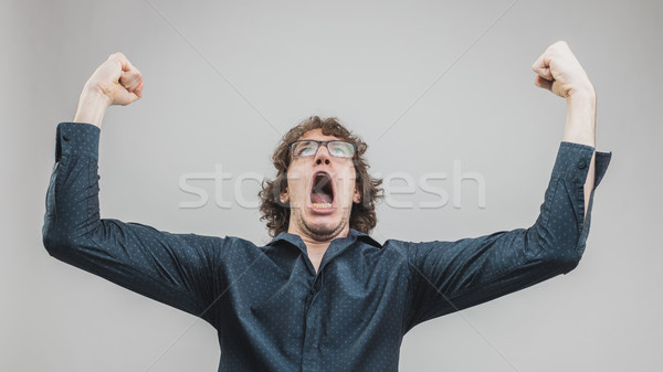 man winning and exulting with a strong expression Stock photo © Giulio_Fornasar