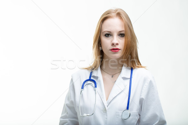 Komoly vonzó fiatal nő orvos nővér visel Stock fotó © Giulio_Fornasar