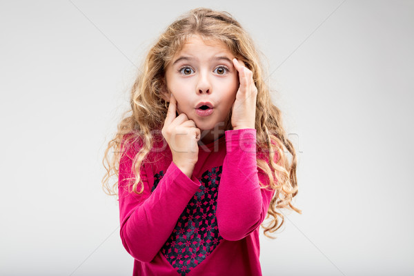Cute little girl with a look of astonishment Stock photo © Giulio_Fornasar